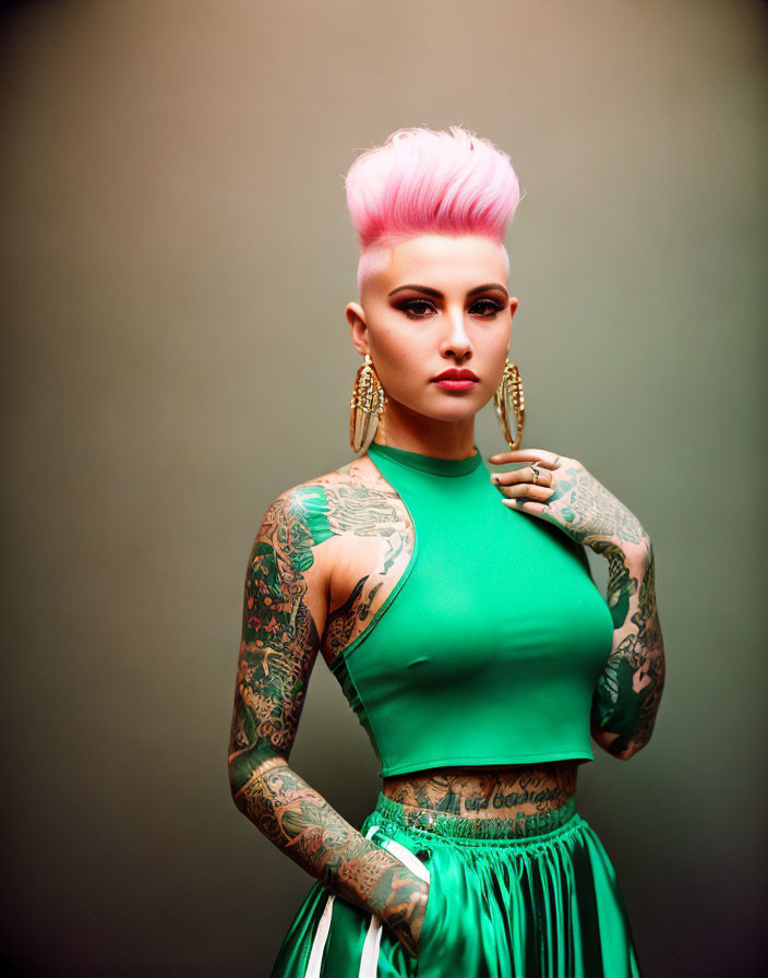 Pink Mohawk Woman in Green Dress with Tattoos and Hoop Earrings