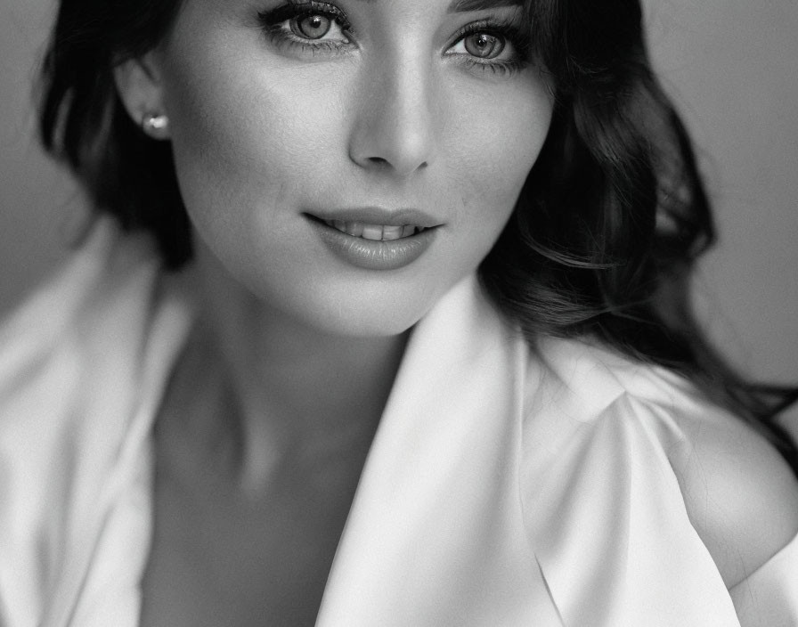 Monochrome portrait of woman with dark hair and white top