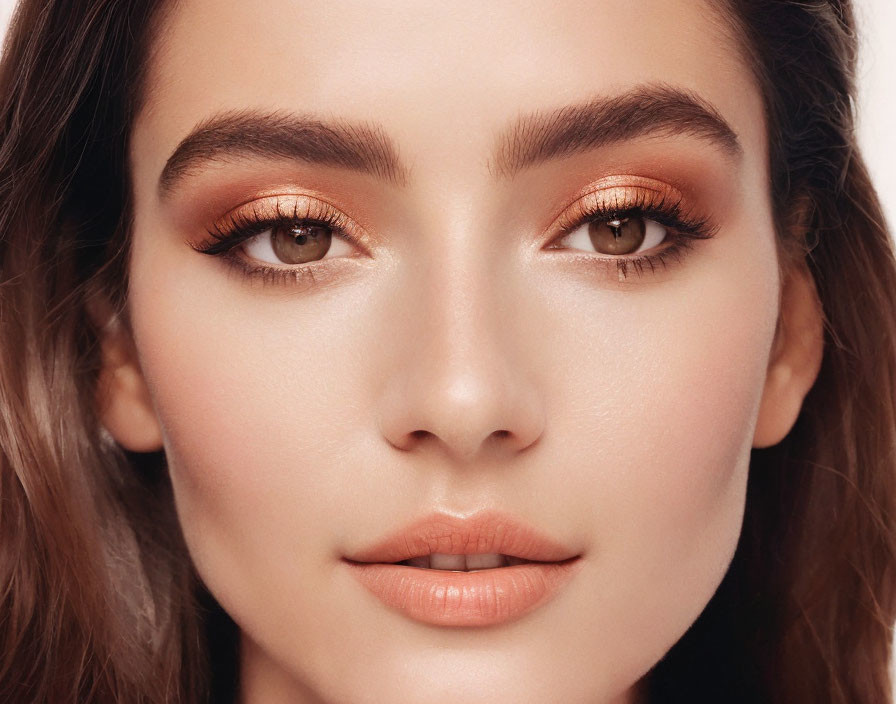 Close-Up Portrait of Person with Flawless Skin and Copper Makeup