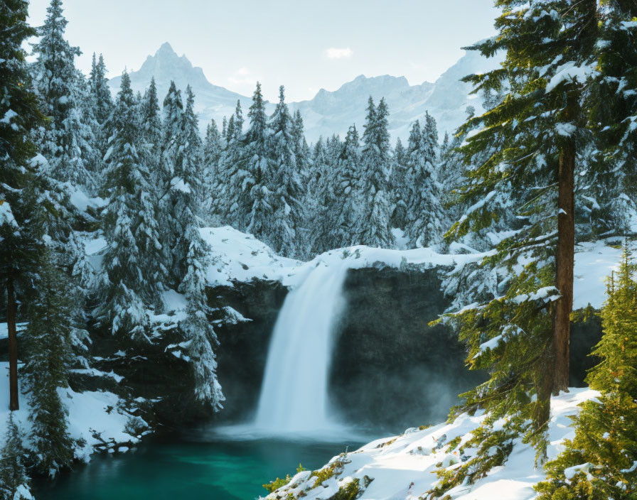 Tranquil winter waterfall in snow-covered landscape