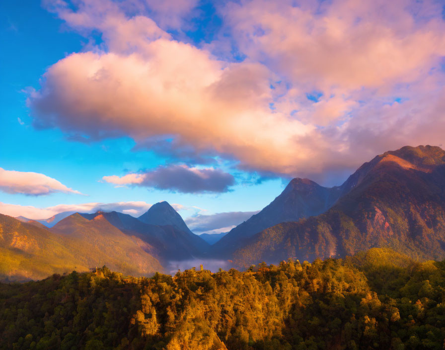 Colorful Sunset Over Towering Mountains and Forested Hills