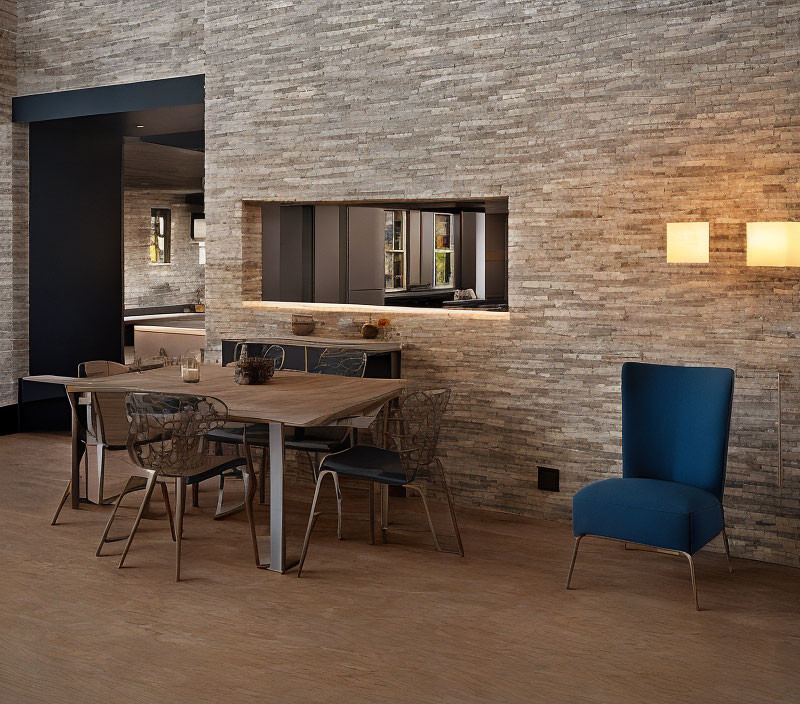 Brick walls, wooden tables, blue chair in modern dining room