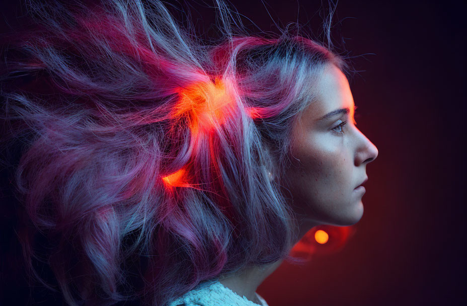 Pinkish Hair Woman Backlit with Red Light on Dark Background