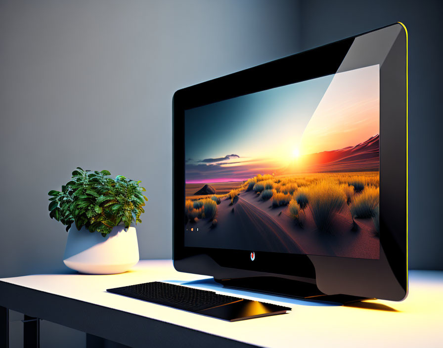 Widescreen monitor on modern desktop with desert sunset and potted plant