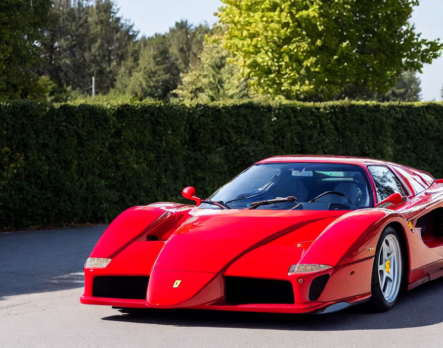 Red Ferrari F40 Sports Car Driving on Road with Pop-Up Headlights