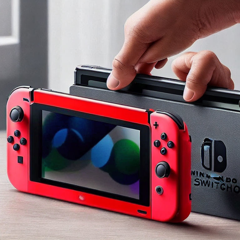 Red Nintendo Switch Console Docked in Black Charging Station with Visible Logo