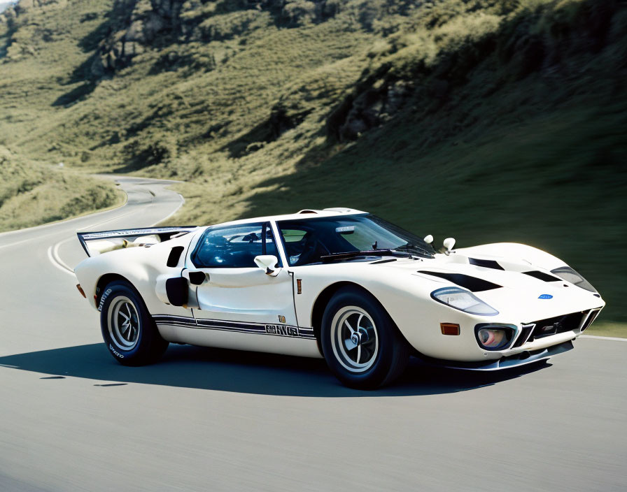 Vintage White Sports Car with Blue Stripes Driving on Road