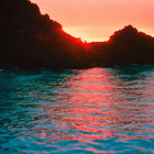 Crimson Skies Sunset Seascape with Silhouetted Rocky Cliffs