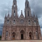 Majestic gothic cathedral with intricate facades and towering spires in dramatic dusk setting