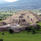 Ancient Mesoamerican Step Pyramid in Lush Landscape