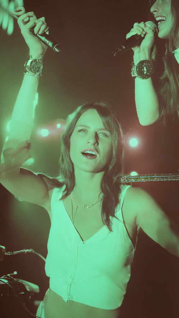 Female Singer on Stage with Microphone and Bright Lights