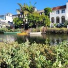 Villa with Green Roofs by Tranquil Pond & Lush Gardens