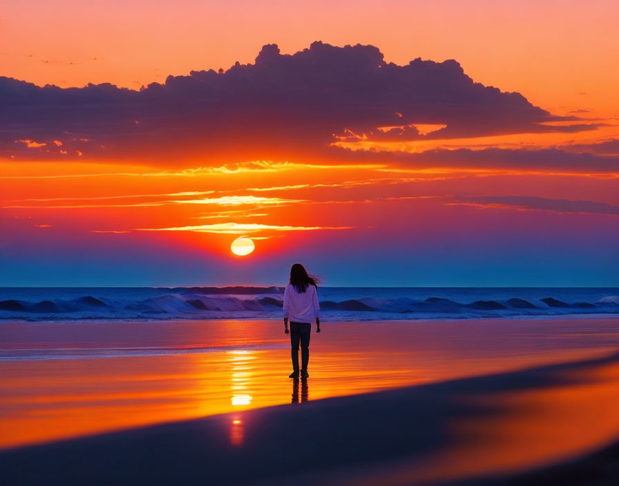 Vibrant sunset beach scene with orange and purple hues at dusk