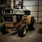 Vintage Tractor on Dusty Road Near Barn with Weathered Paint