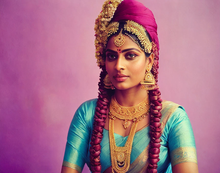 Traditional Indian Attire Woman with Magenta Headscarf and Gold Jewelry