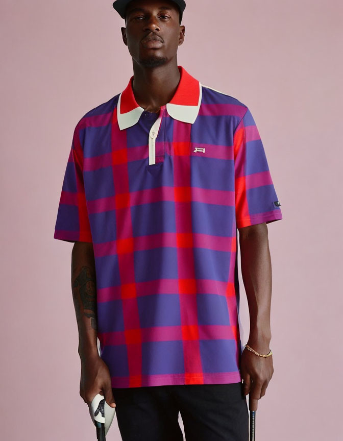 Checkered Pattern Polo Shirt with Blue and Red Squares and Visible Tattoo