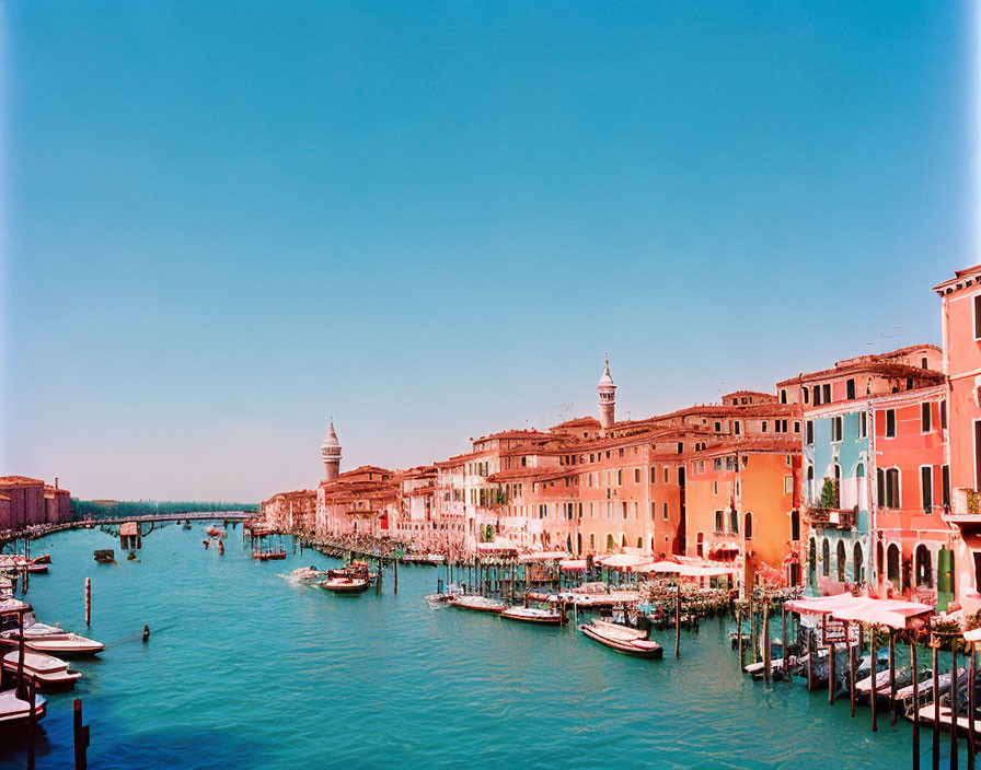 Colorful Buildings Along Grand Canal, Venice: Boats Docked Under Blue Sky