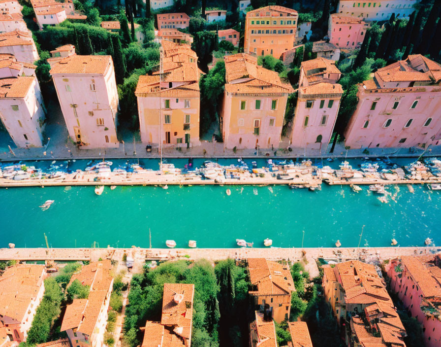 Colorful Buildings and Boats Along Canal in European Town