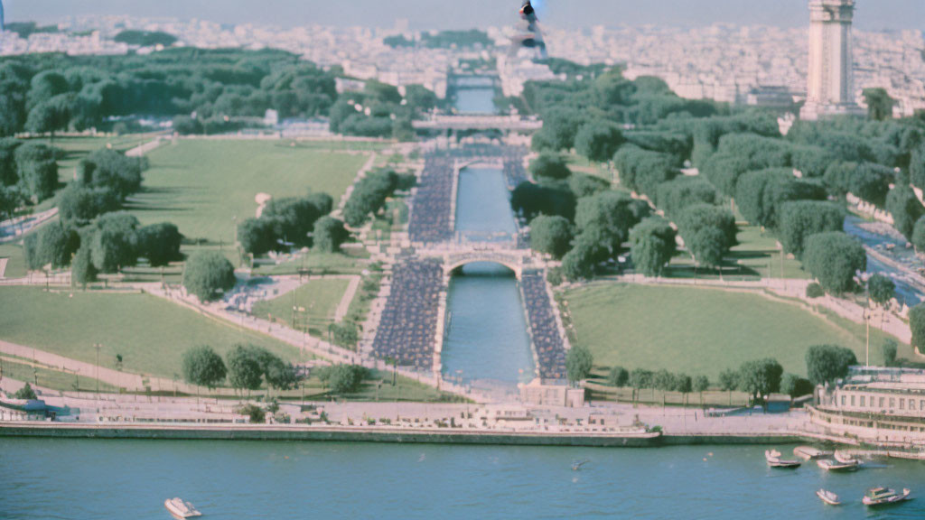 Green park with trees, river boats, cityscape, and flying bird