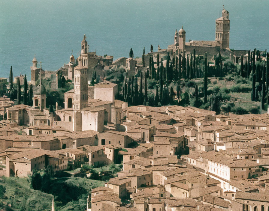 Italian Hilltop Town: Panoramic View with Historical Buildings & Cypress Trees