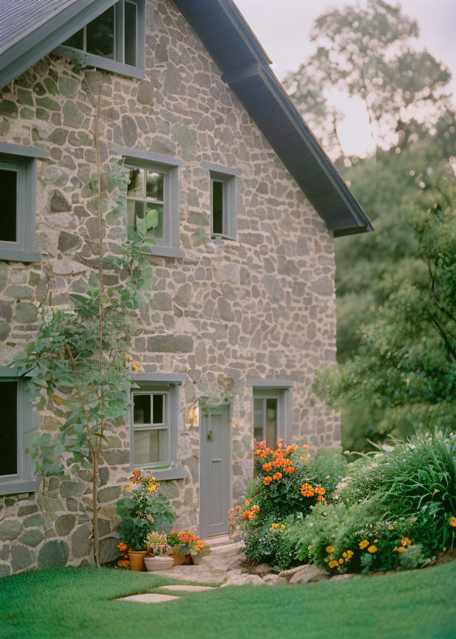 Quaint Stone House with Green Door and Lush Gardens