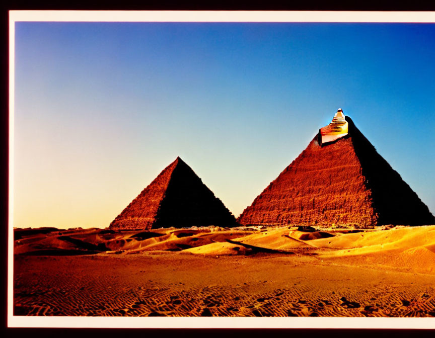 Ancient Egyptian pyramids under clear sky with warm lighting