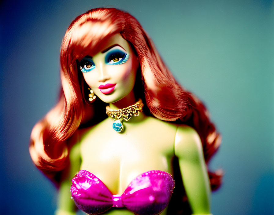 Red-Haired Barbie Doll Close-Up with Blue Eyes and Pink Outfit