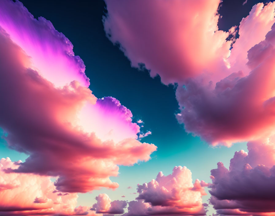 Colorful pink and purple clouds in a deep blue sky.