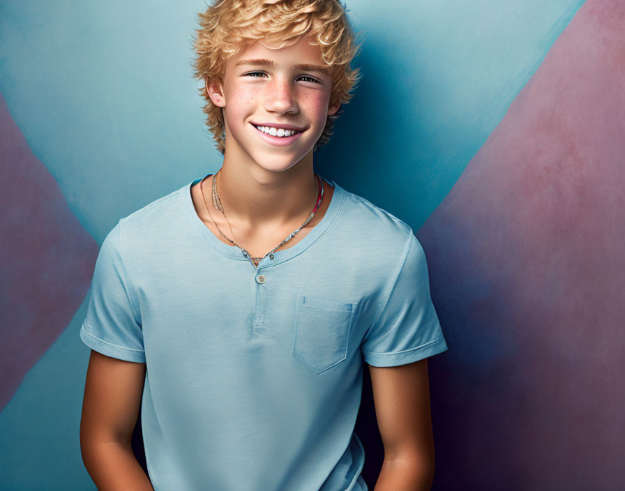 Blonde person in blue henley shirt on blue background