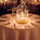 Decorative glass bottles with glowing string lights and blue ribbons on dark background