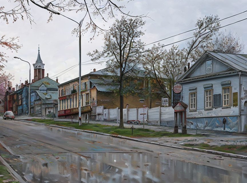 Historic wooden houses and church spire on quiet street with leafless trees and reflective puddles.