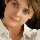 Portrait of a Young Girl with Heterochromatic Eyes in White Blouse