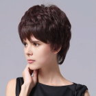 Young girl with short brown haircut gazing sideways on grey background