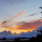 Twilight landscape with shooting star over misty mountains