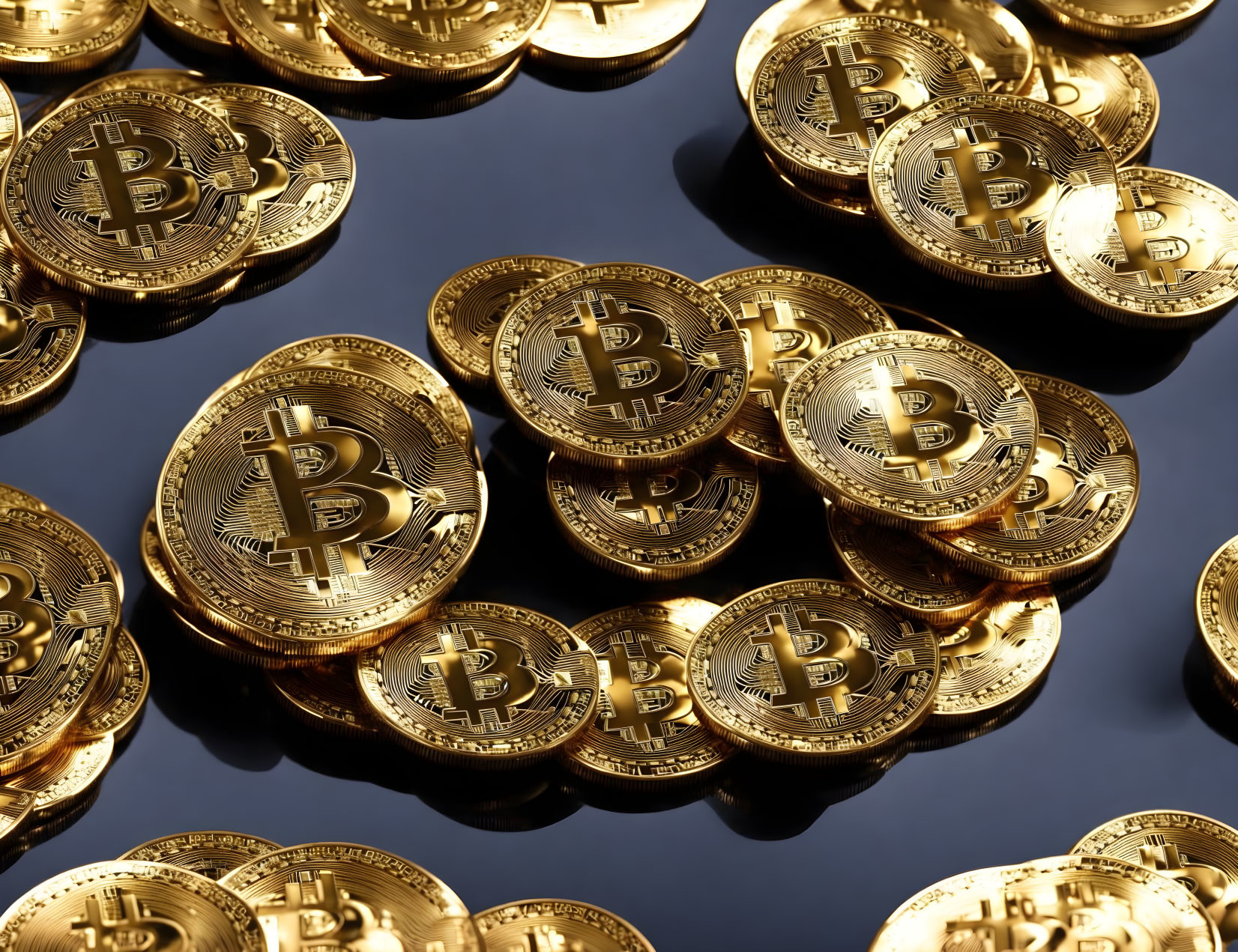 Gold Bitcoin Tokens Scattered on Reflective Surface