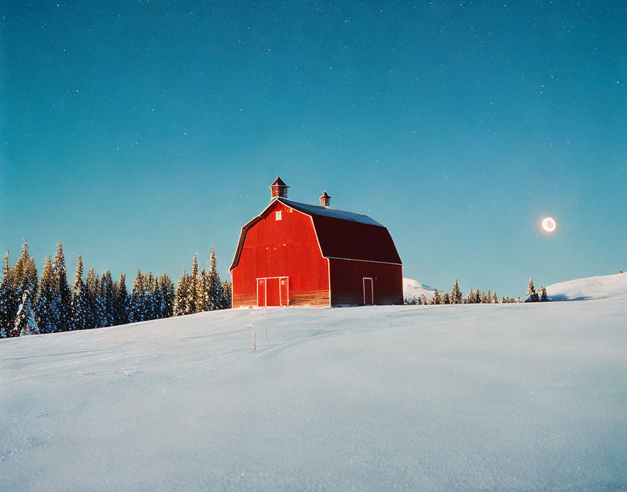 Red Barn in Snowy Landscape with Moon and Evergreen Trees