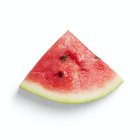 Ripe watermelon slice with red flesh and black seeds on white background