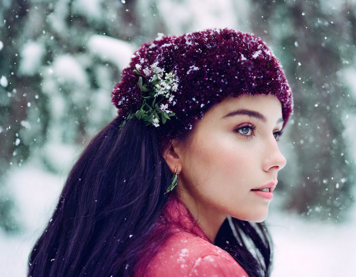 Woman in Maroon Beret with Snowflakes in Hair on Snowy Day