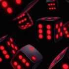 Glowing red dice with illuminated dots in dark, gaming-themed setting