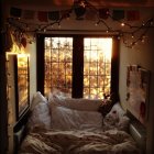 Cozy cabin interior at twilight with plush sofa and autumn foliage view.