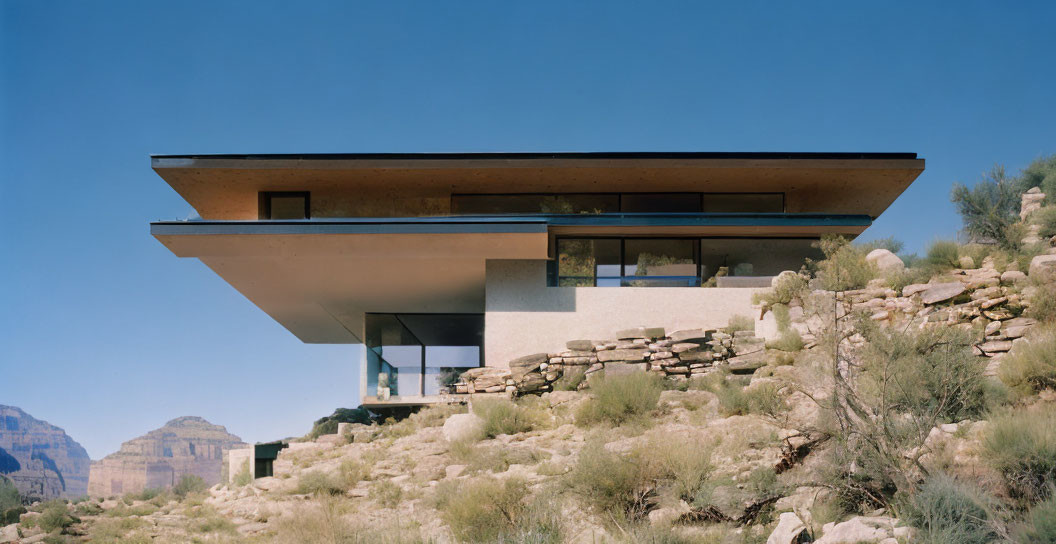 Contemporary cantilevered glass house in desert setting