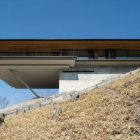 Contemporary cantilevered glass house in desert setting