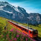 Scenic red train in snowy mountain landscape