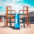 Vibrant playground with slides and climbing structures on sunny day