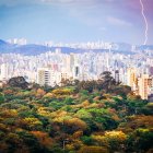 Futuristic cityscape with high-rise buildings and stormy sky