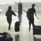 Abstract brushstroke painting of three stylish women with suitcases