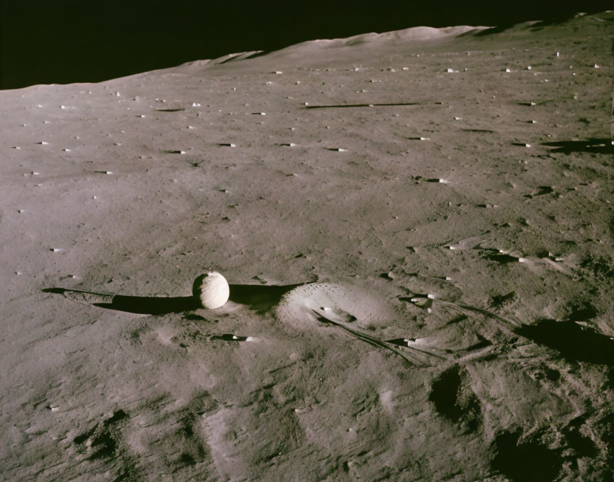 Monochrome Moon surface with craters, rocks, and Earth in background