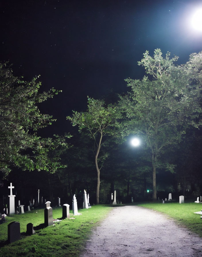 Nighttime Cemetery with Illuminated Tombstones and Starry Sky