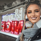 Digital artwork: Young woman with freckles in pensive pose, red tram in futuristic cityscape