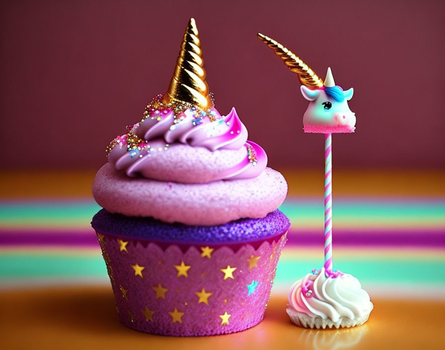 Whimsical purple cupcake and unicorn lollipop on pink backdrop